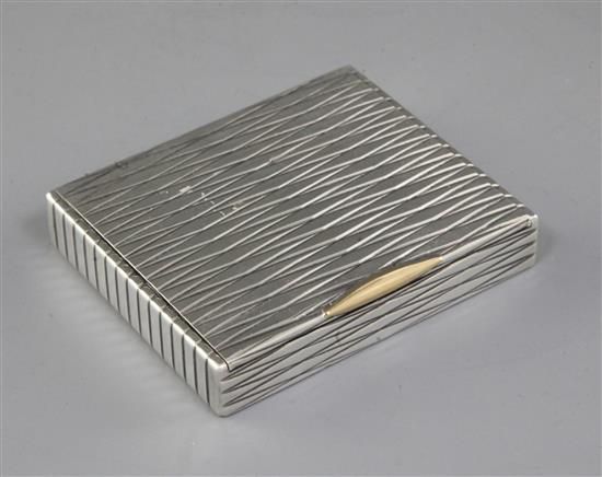A 1940s Cartier silver cigarette case with 18ct gold thumbpiece, 9.5cm.